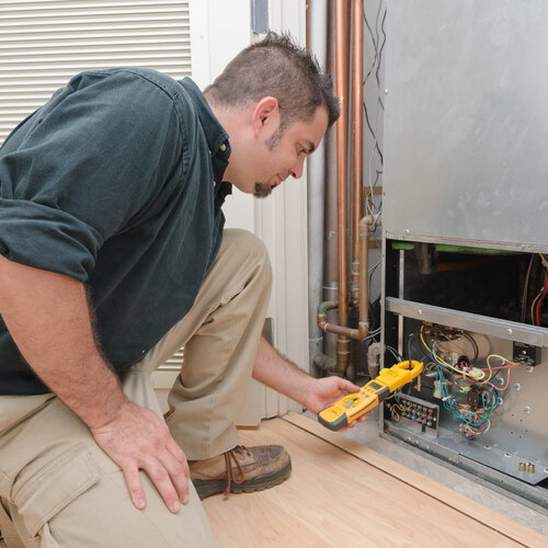 technician working on an HVAC system