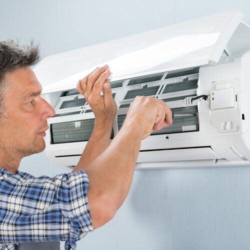 technician providing air conditioner repair